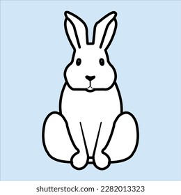 A cute rabbit is sitting on the floor