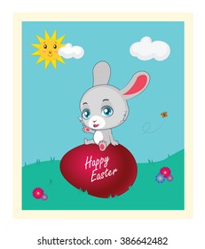 Cute rabbit sitting on top of a painted egg