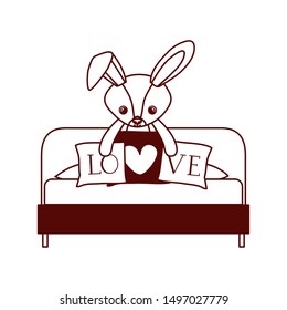cute rabbit of stuffed with heart love pillows in the sofa