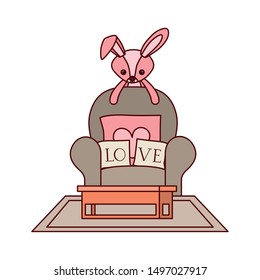 cute rabbit of stuffed with heart love pillows in the sofa