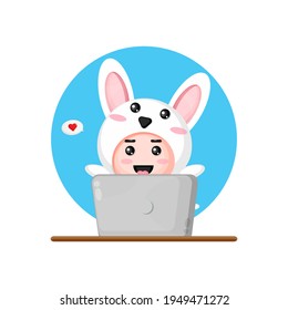 Cute rabbit using a laptop