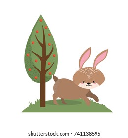 cute rabbit wild animal next to tree