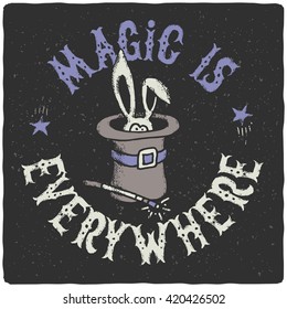 Cute rabbit in a wizard cylinder hat with a wand. Lettering slogan "Magic is everywhere"