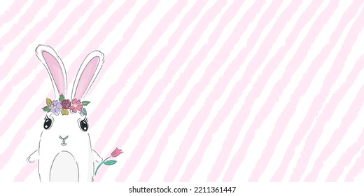Cute rabbit in a wreath of flowers. The hare is white on a spring or summer background of pink stripes.