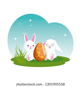 cute rabbits couple with easter egg painted