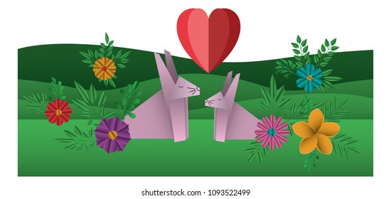 cute rabbits couple origami paper in the field