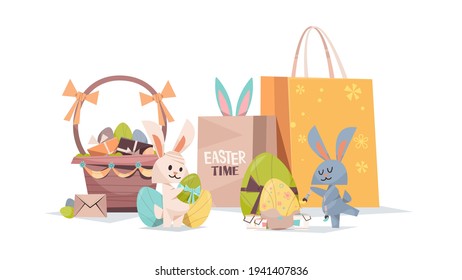 cute rabbits with decorated eggs basket and shopping bags happy easter spring holiday composition