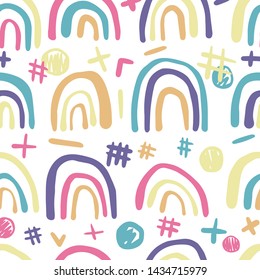 Cute rainbows seamless pattern . Hand drawn scrawl wallpaper. Vector background. Simple design for fabric, textile print, wrapping.