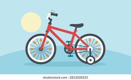 Cute red children bicycle with training wheels parked on a grassy field against a clear blue sky on a sunny day.