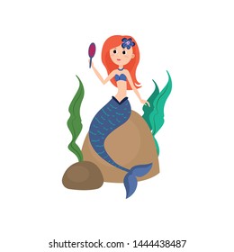 Cute red hair mermaid looking in hand mirror
