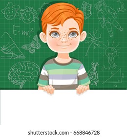 Cute red haired boy holds large white horizontal banner on green background