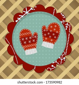 Cute red wool mittens with embroidery for christmas card.
