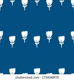 Cute Repeat Tulip Wildflower Pattern with pantone color of the year classic blue background. Seamless floral pattern. white tulip. Stylish repeating texture. 