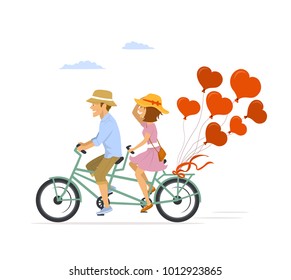 cute romantic cheerful couple riding tandem bike with heart shaped balloons