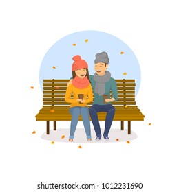 cute romantic couple sitting on a bench in the park, autumn falling leaves scene