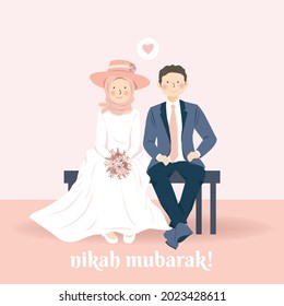Cute Romantic Muslim Wedding Couple Sitting in Beach with their Wedding Attire Smiling