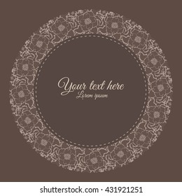 Cute round frame with flowers and leaves on brown background