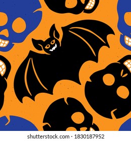 Cute and scary Halloween seamless pattern. Skulls and bats on yellow  background. Vector shabby hand drawn illustration