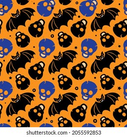 Cute and scary Halloween seamless pattern. Skulls and bats in cartoon style on a yellow background. Set of vector flat hand drawn holiday symbols