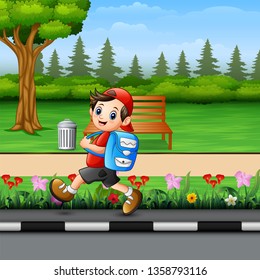 Cute school boy going to school pass through a park