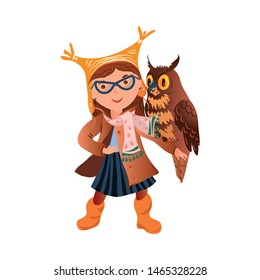 Cute school girl in eyeglasses and autumn headwear take a owl