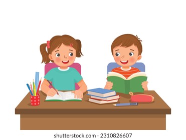 Cute school kids studying doing homework together at the desk