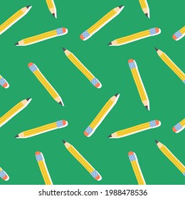 Cute school seamless pattern. Yellow graphite pencils on green background. Vector hand-drawn illustration for textile, fabric, wrapping paper and other print and design.