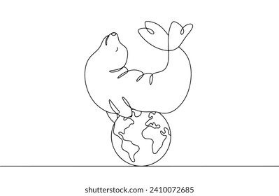 A cute seal lies on the globe. Protecting seals as an endangered species. Smart predatory animal. World Whale Day. Images produced without the use of any form of AI software at any stage. 