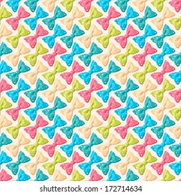 Cute seamless background with colored bows with dots. vector illustration 