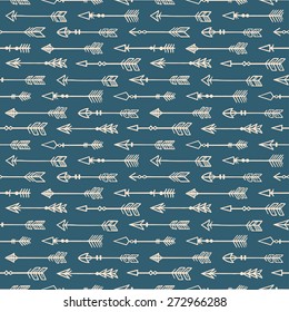 Lindo fondo sin fisuras con flechas beige dibujadas a mano sobre un fondo azul oscuro