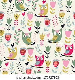 Cute seamless background with owls and flowers in cartoon style