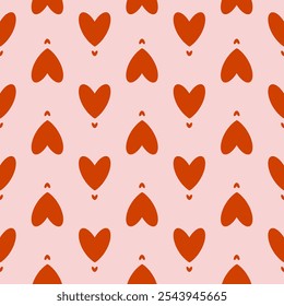 Padrão bonito e sem emenda do Dia dos Namorados com corações vermelhos. Impressão de presente para a celebração do amor. Corações grandes e pequenos em um fundo rosa para têxteis, embrulho de presente e design