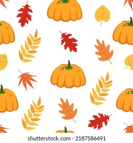 Cute seamless pattern with autumn leaves, pumpkins