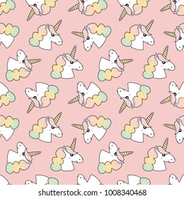Cute seamless pattern background with colorful hand drawn unicorns.
