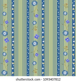Cute seamless pattern with blue stripes of different thicknesses and a variety of small flowers on a green background. Botanical motifs are scattered by vertical columns. Vector for fashion prints