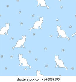 Cute seamless pattern with cats, paw prints