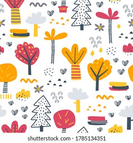 Cute seamless pattern in childish style. Different kinds of trees. Perfect for kids fabric, textile, nursery wallpaper. Hand drawn forest.
