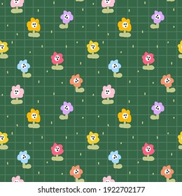 Cute seamless pattern with colorful tiny flowers on the green checkered pattern background. Vector doodle flowers. Fun kids pattern for fabric and clothes.