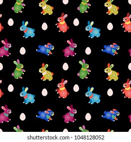 Cute seamless pattern. Easter bunnies and eggs. Funny easter card.