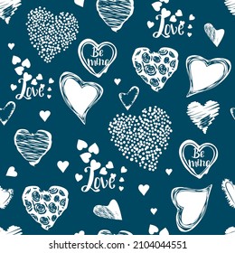 Cute seamless pattern with grunge hearts and hand lettered text.Background and texture with romantic elements white color on blue for printing on fabrics and paper.Trendy hand drawn illustration.  