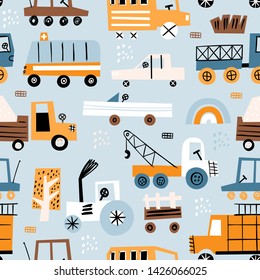 Cute seamless pattern with hand drawn toy cars. Perfect for kids fabric, textile, nursery wallpaper. Blue background. 