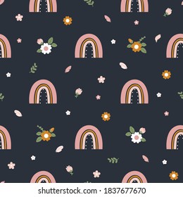 Cute seamless pattern with hand drawn rainbows and flowers on a dark blue background. Trendy baby texture for fabric textile wallpaper apparel wrappin