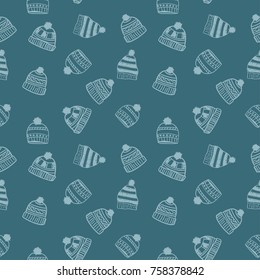 Cute seamless pattern with hand-drawn hats. Winter mood.