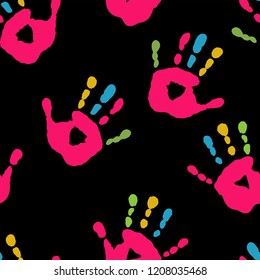 Cute seamless pattern with a handprints on a black background