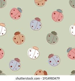 Cute seamless pattern with ladybugs on a delicate green background