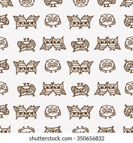 Cute seamless pattern with little cartoon owls. Stylish graphic design.