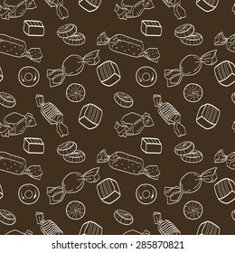 Cute seamless pattern made of hand drawn doodle sweets on dark background. Cartoon candy tiling background.