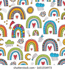 Cute seamless pattern with magic rainbows, stars and clouds. Can be used in textile industry, paper, background, scrapbooking.