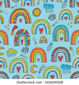 Cute seamless pattern with magic rainbows, stars and clouds. Can be used in textile industry, paper, background, scrapbooking.