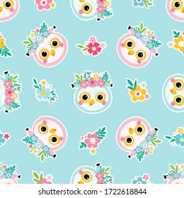 Cute seamless pattern with owl faces and flowers on a turquoise background. Childrens vector illustration.